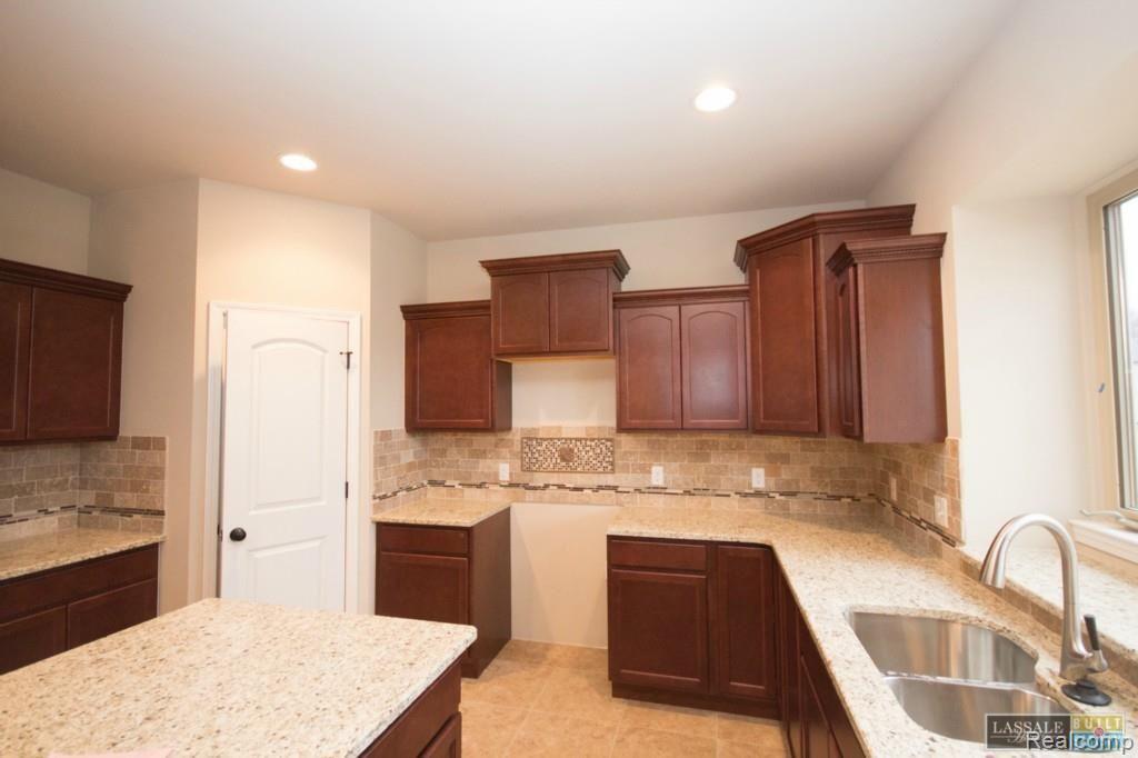 22654 Brantingham Road Macomb, MI 48044 - Photo 15 of 32 Lot 87 Bluffs of Beaufait Gia Ranch Kitchen 3-22-15.jpg