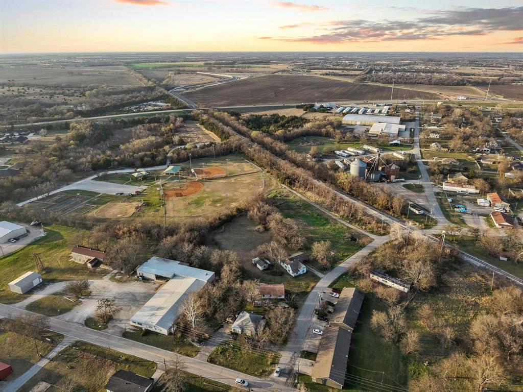 120 Holmes Street, Unit LOT 2 Trenton, TX 75490 - Photo 13 of 21 an aerial view of residential building and lake view