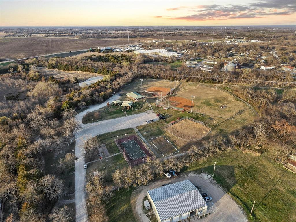120 Holmes Street, Unit LOT 2 Trenton, TX 75490 - Photo 15 of 21 an aerial view of residential houses with outdoor space