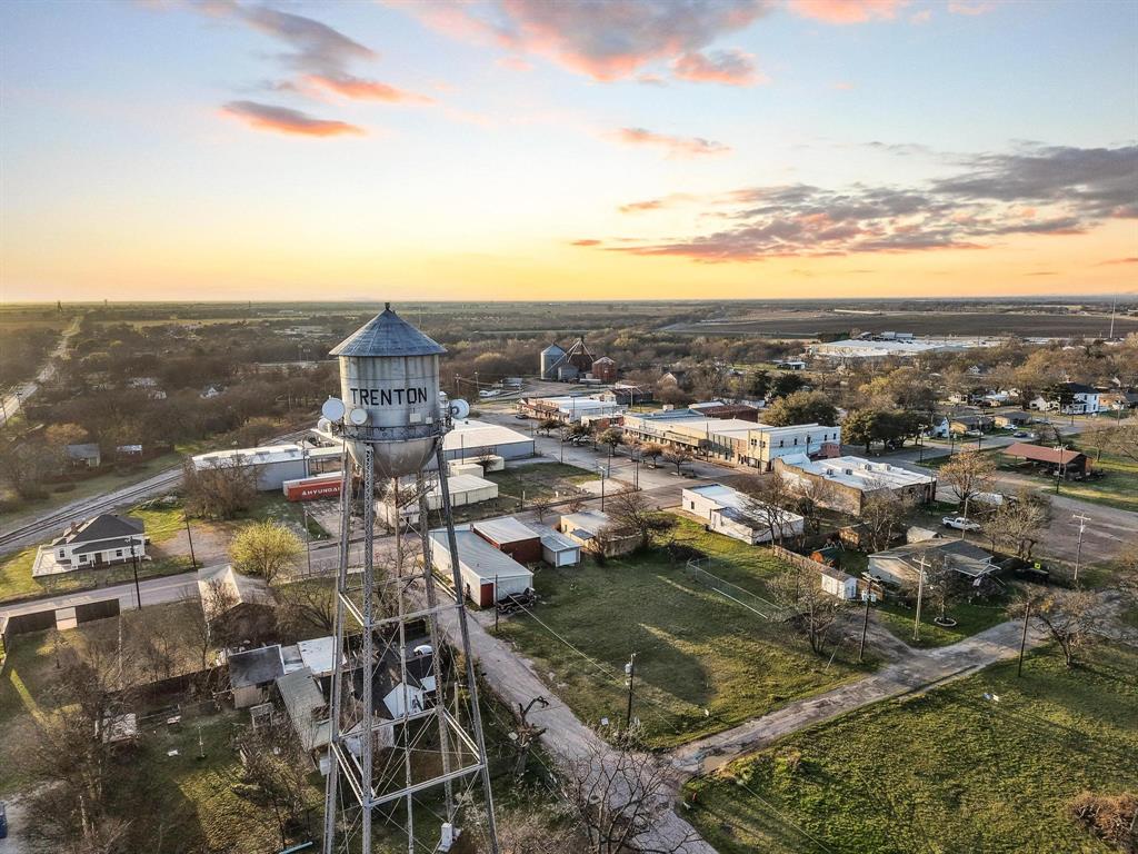120 Holmes Street, Unit LOT 2 Trenton, TX 75490 - Photo 16 of 21 a view of a city