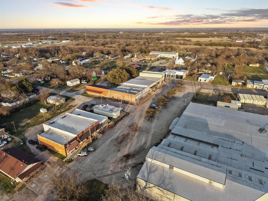 120 Holmes Street, Unit LOT 2 Trenton, TX 75490 - Photo 17 of 21 an aerial view of residential houses with outdoor space