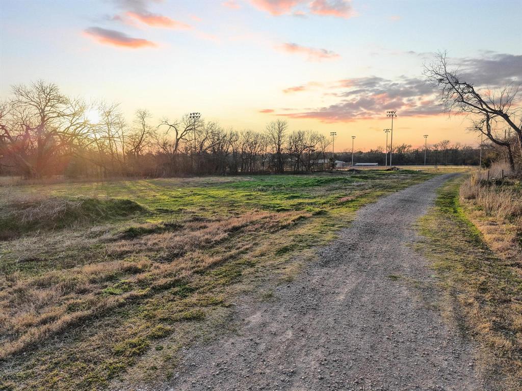120 Holmes Street, Unit LOT 2 Trenton, TX 75490 - Photo 20 of 21 a view of a lake with houses in the back