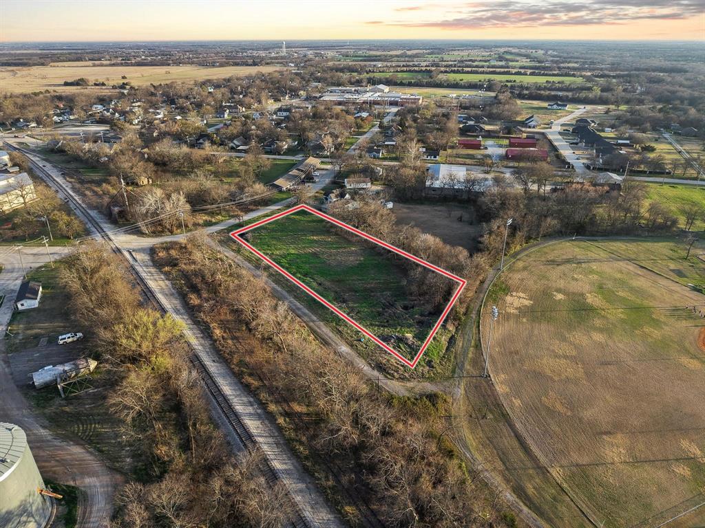 120 Holmes Street, Unit LOT 2 Trenton, TX 75490 - Photo 7 of 21 a view of a city