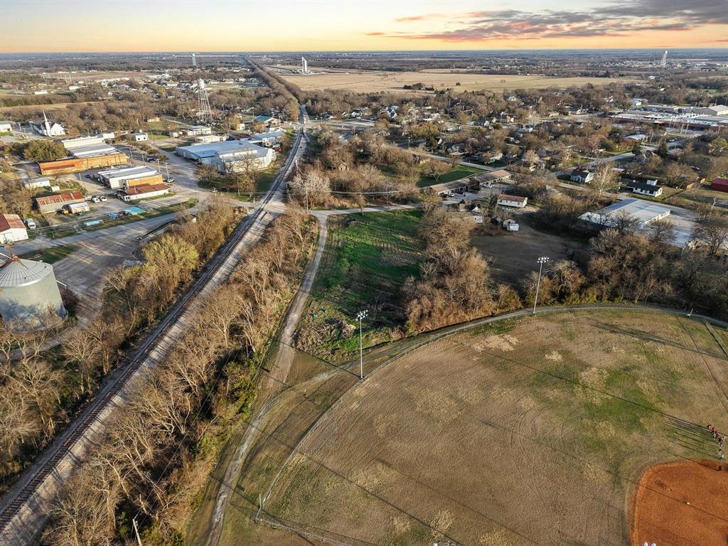120 Holmes Street, Unit LOT 2 Trenton, TX 75490 - Photo 8 of 21 an aerial view of multiple house