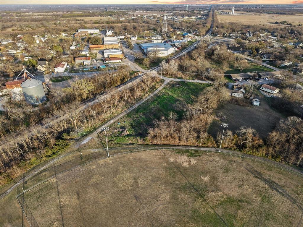 120 Holmes Street, Unit LOT 2 Trenton, TX 75490 - Photo 9 of 21 an aerial view of multiple house