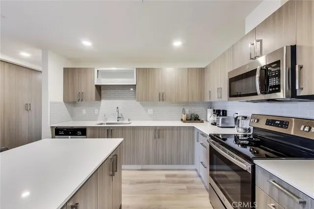 a bed room with a bed and a painting on the wall