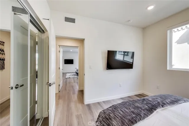 a bathroom with a double vanity sink a toilet and a shower