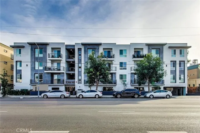 a view of a livingroom with furniture and a window