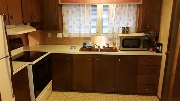 46 Rest Way Springfield, MA 01119 - Photo 6 of 9 a kitchen with a sink a window and cabinets