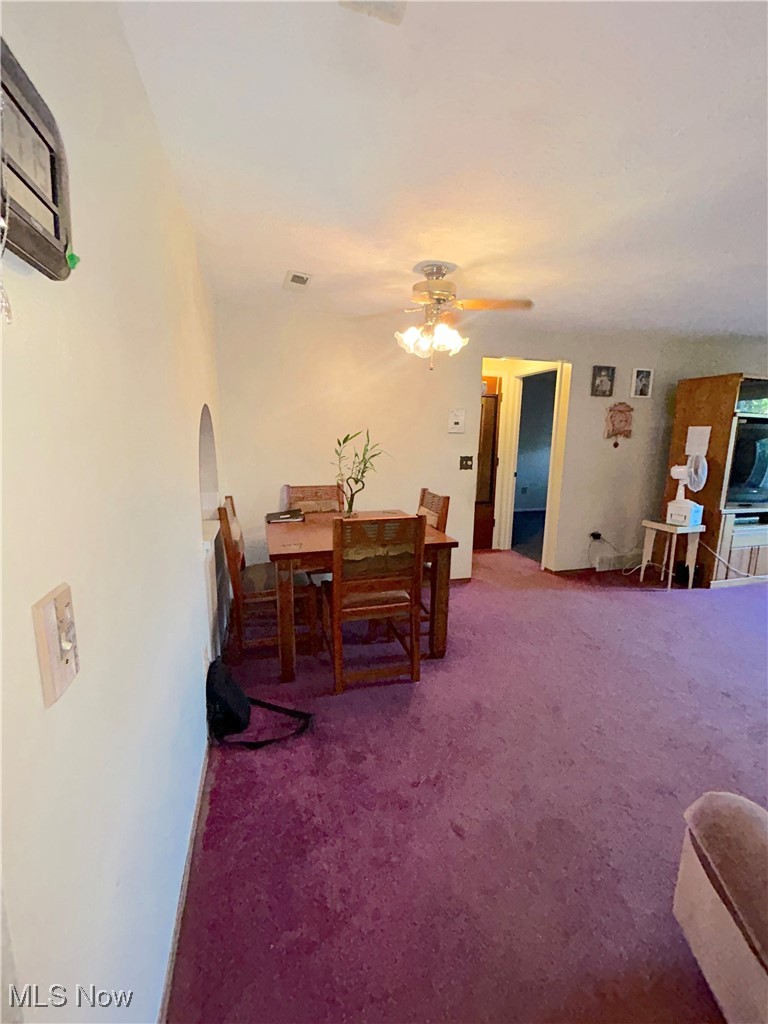 8753 West Ridge Road, Unit A Elyria, OH 44035 - Photo 7 of 21 Dining space with carpet and ceiling fan