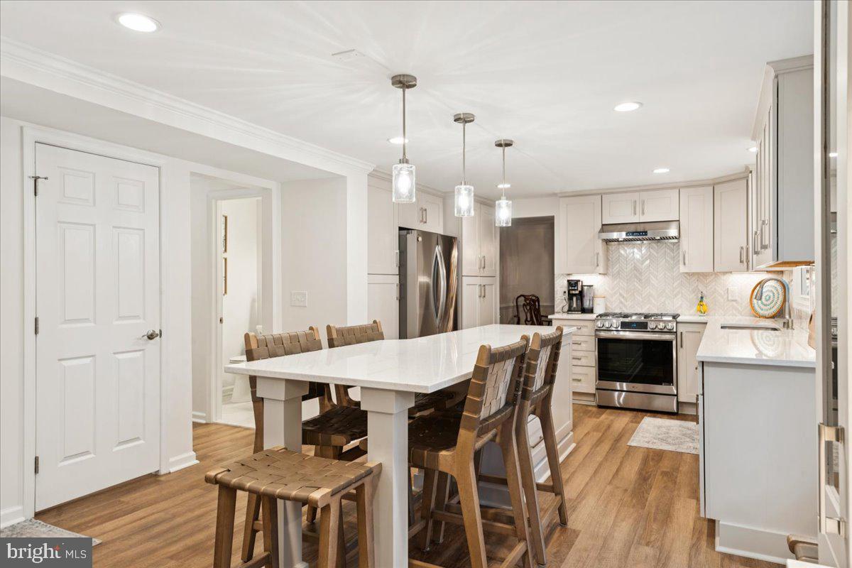 1377 Rock Chapel Road Herndon, VA 20170 - Photo 11 of 65 a large kitchen with a table and chairs