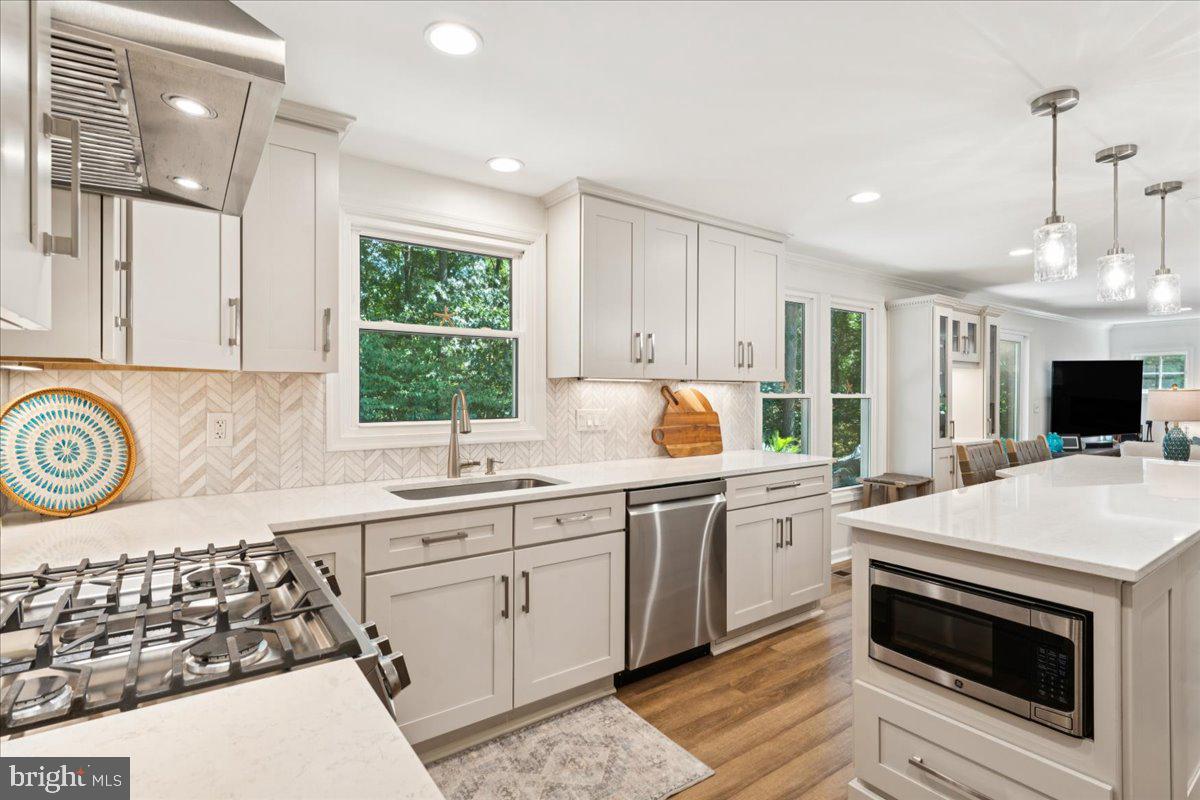 1377 Rock Chapel Road Herndon, VA 20170 - Photo 13 of 65 a kitchen with a stove a sink and a refrigerator
