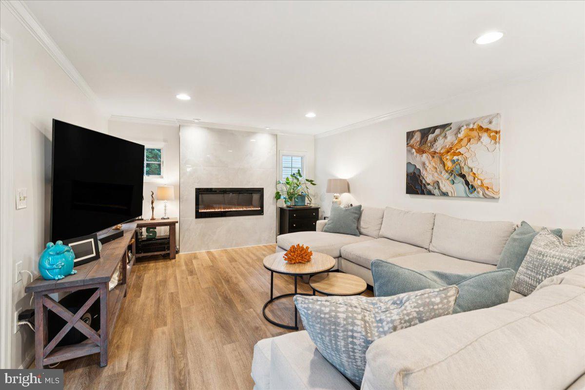 1377 Rock Chapel Road Herndon, VA 20170 - Photo 18 of 65 a living room with furniture and a flat screen tv