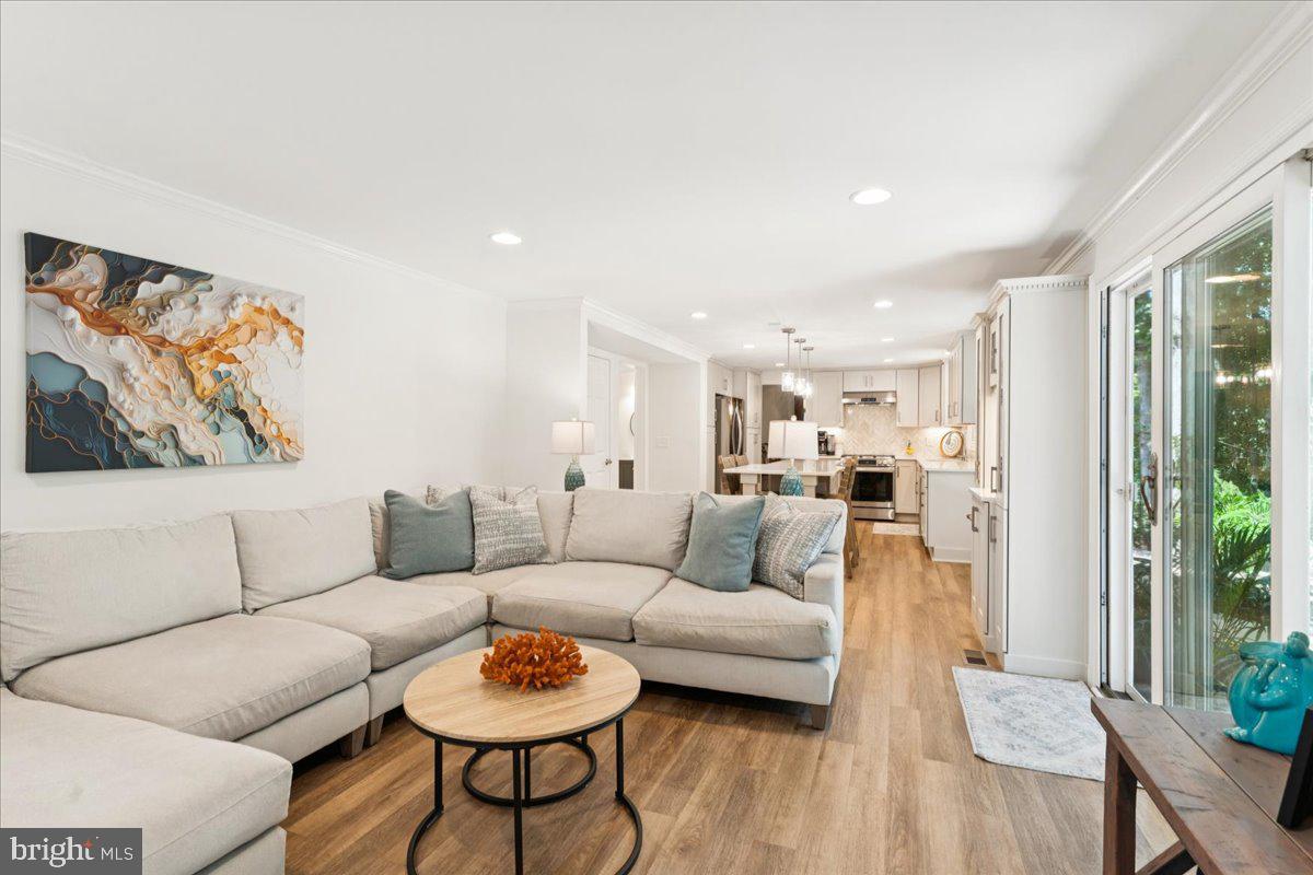 1377 Rock Chapel Road Herndon, VA 20170 - Photo 20 of 65 a living room with furniture and a wooden floor