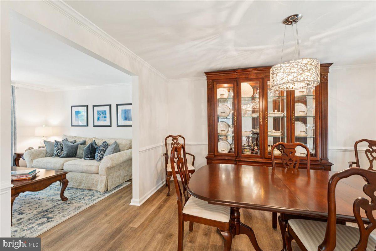 1377 Rock Chapel Road Herndon, VA 20170 - Photo 23 of 65 a view of a dining room with furniture window and wooden floor