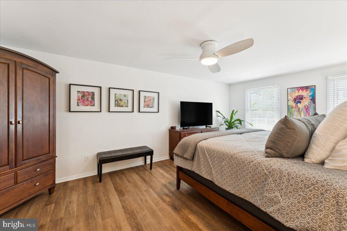 1377 Rock Chapel Road Herndon, VA 20170 - Photo 27 of 65 a bedroom with a bed and a flat screen tv