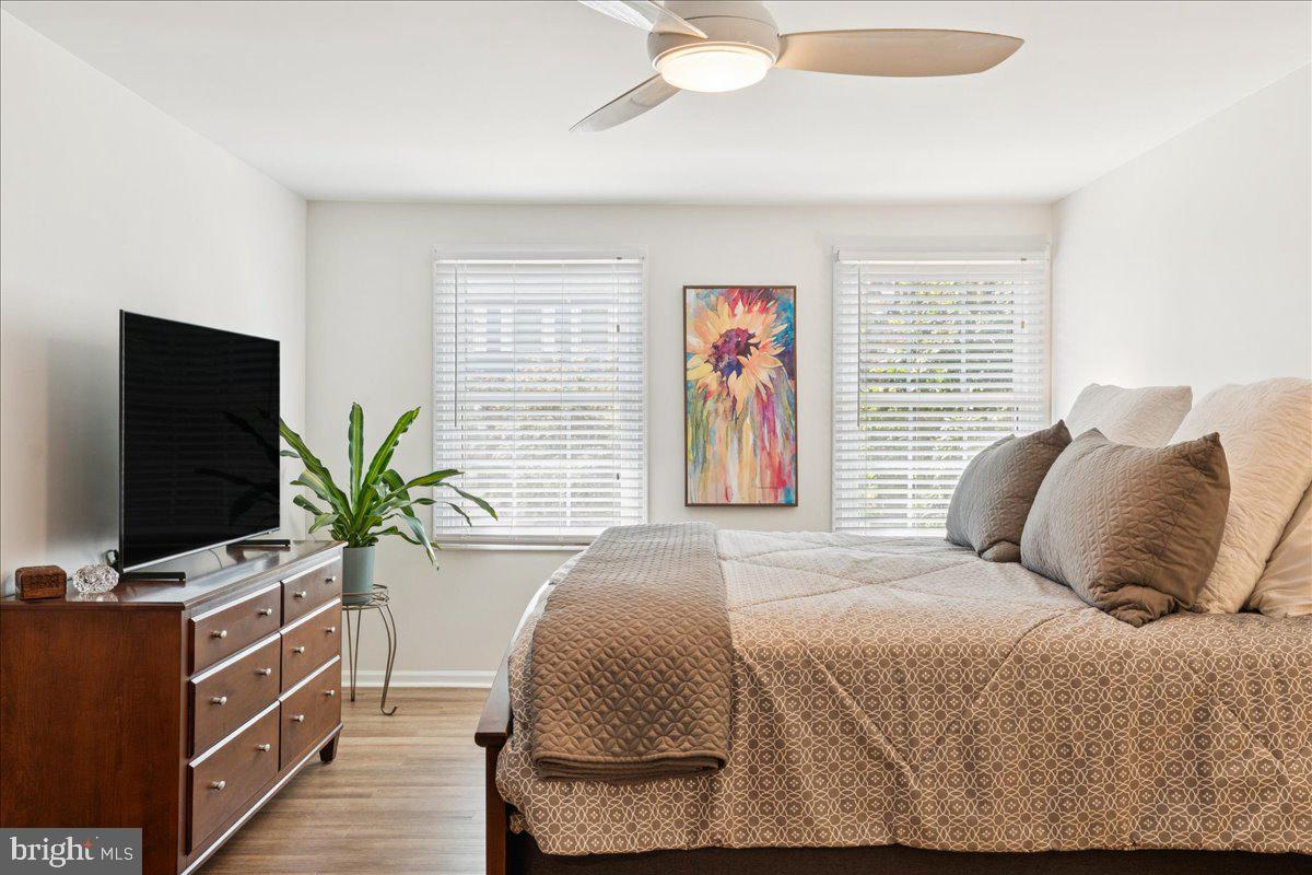 1377 Rock Chapel Road Herndon, VA 20170 - Photo 28 of 65 a bedroom with a bed and a flat screen tv