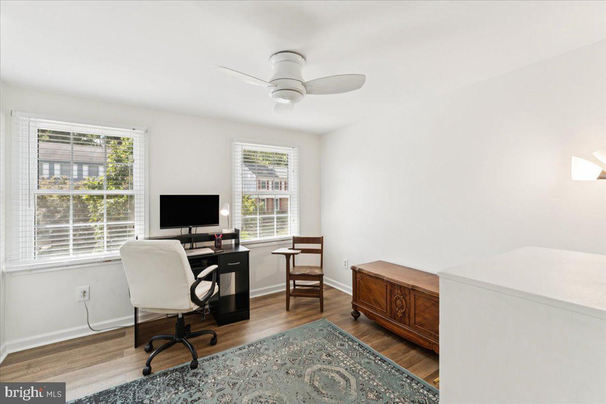 1377 Rock Chapel Road Herndon, VA 20170 - Photo 35 of 65 a view of a workspace with furniture and a window