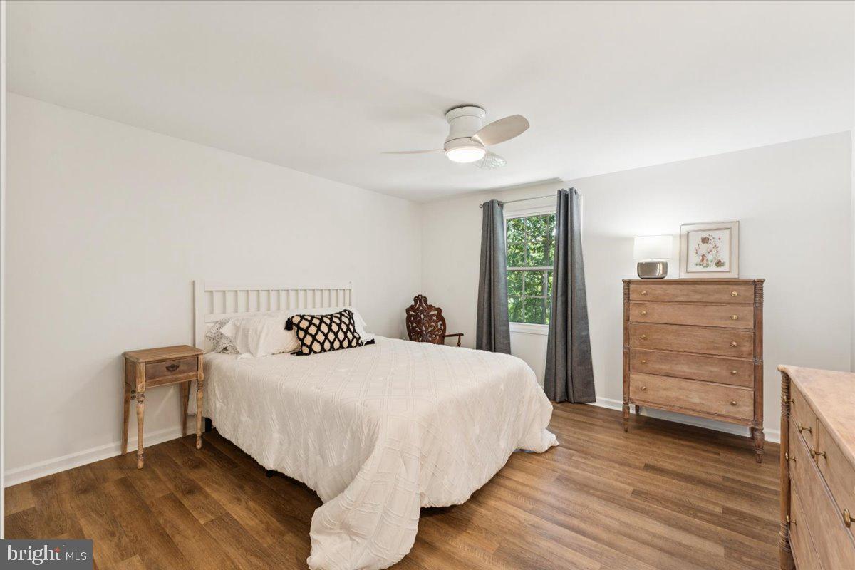 1377 Rock Chapel Road Herndon, VA 20170 - Photo 38 of 65 a bedroom with a bed and a dresser