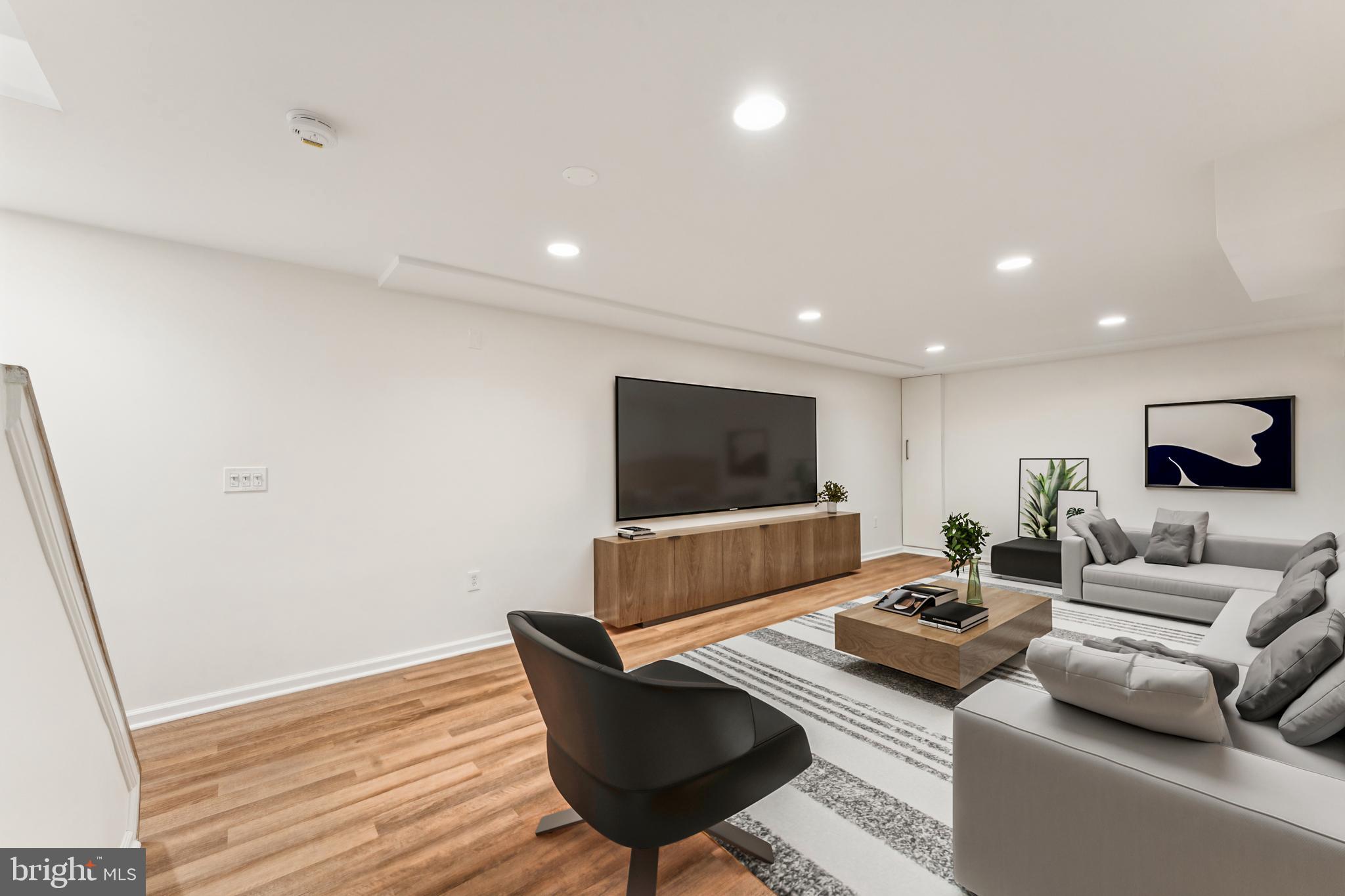 1377 Rock Chapel Road Herndon, VA 20170 - Photo 41 of 65 a living room with furniture and a flat screen tv