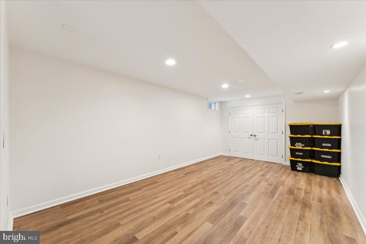 1377 Rock Chapel Road Herndon, VA 20170 - Photo 44 of 65 a view of empty room with wooden floor and cabinets