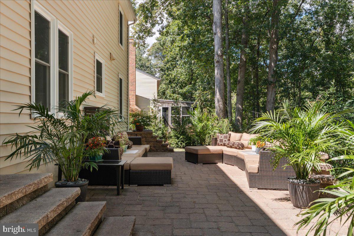 1377 Rock Chapel Road Herndon, VA 20170 - Photo 50 of 65 a view of a patio with couches and a potted plants with sky view