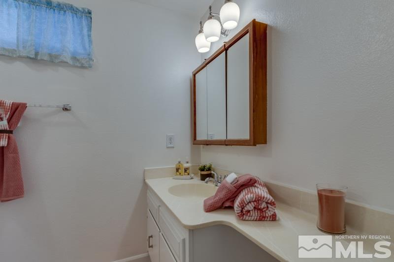 1830 Prior Road Reno, NV 89503 - Photo 12 of 16 a bathroom with a sink and a mirror