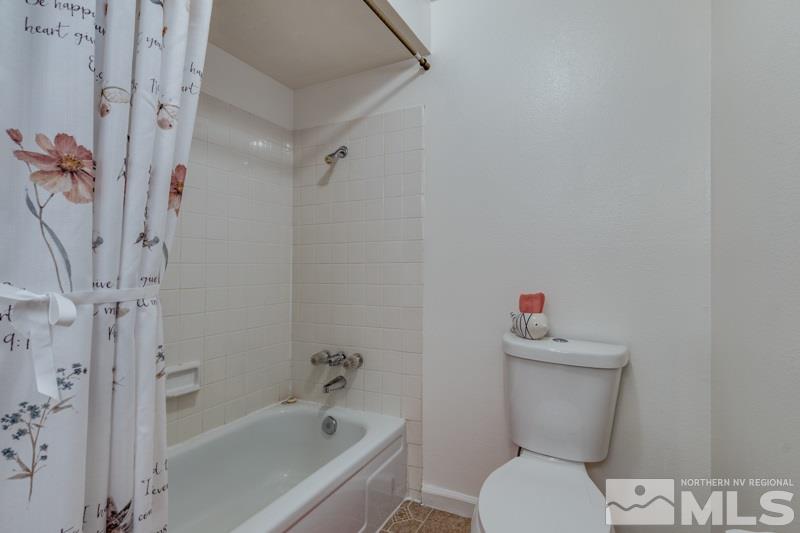 1830 Prior Road Reno, NV 89503 - Photo 13 of 16 a white toilet sitting next to a bath tub