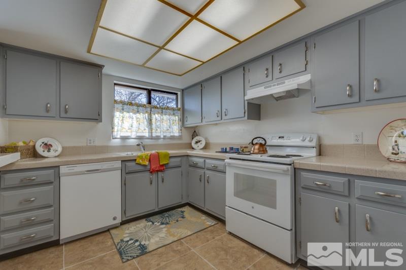1830 Prior Road Reno, NV 89503 - Photo 6 of 16 a kitchen with stainless steel appliances granite countertop a sink and cabinets