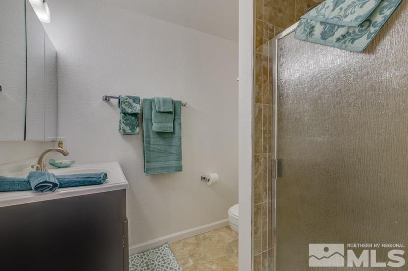1830 Prior Road Reno, NV 89503 - Photo 9 of 16 a bathroom with a sink and mirror