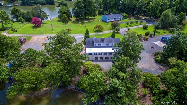 271 Burnt Wharf Road Lancaster, VA 22503 - Photo 1 of 35 an aerial view of a house with a garden