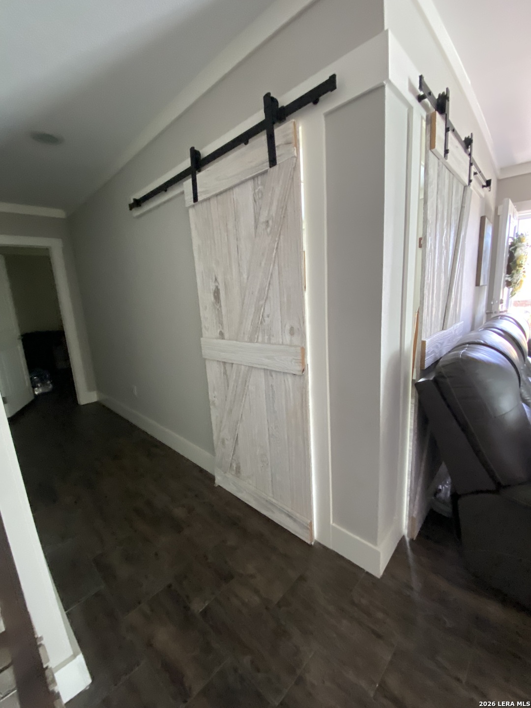 316 County Road 775 Devine, TX 78016 - Photo 4 of 10 a view of walk in closet with wooden floor