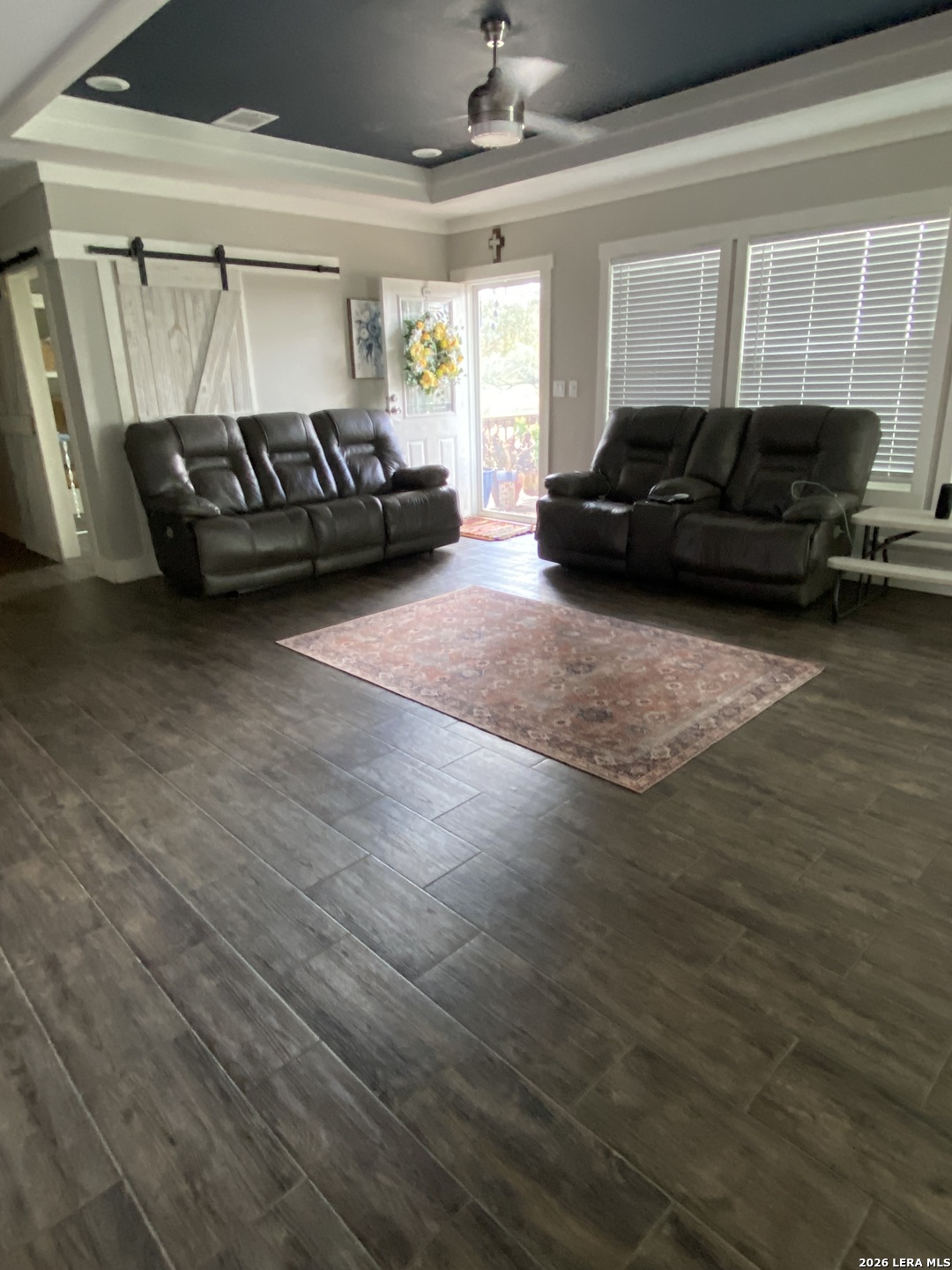 316 County Road 775 Devine, TX 78016 - Photo 6 of 10 a living room with furniture and a wooden floor
