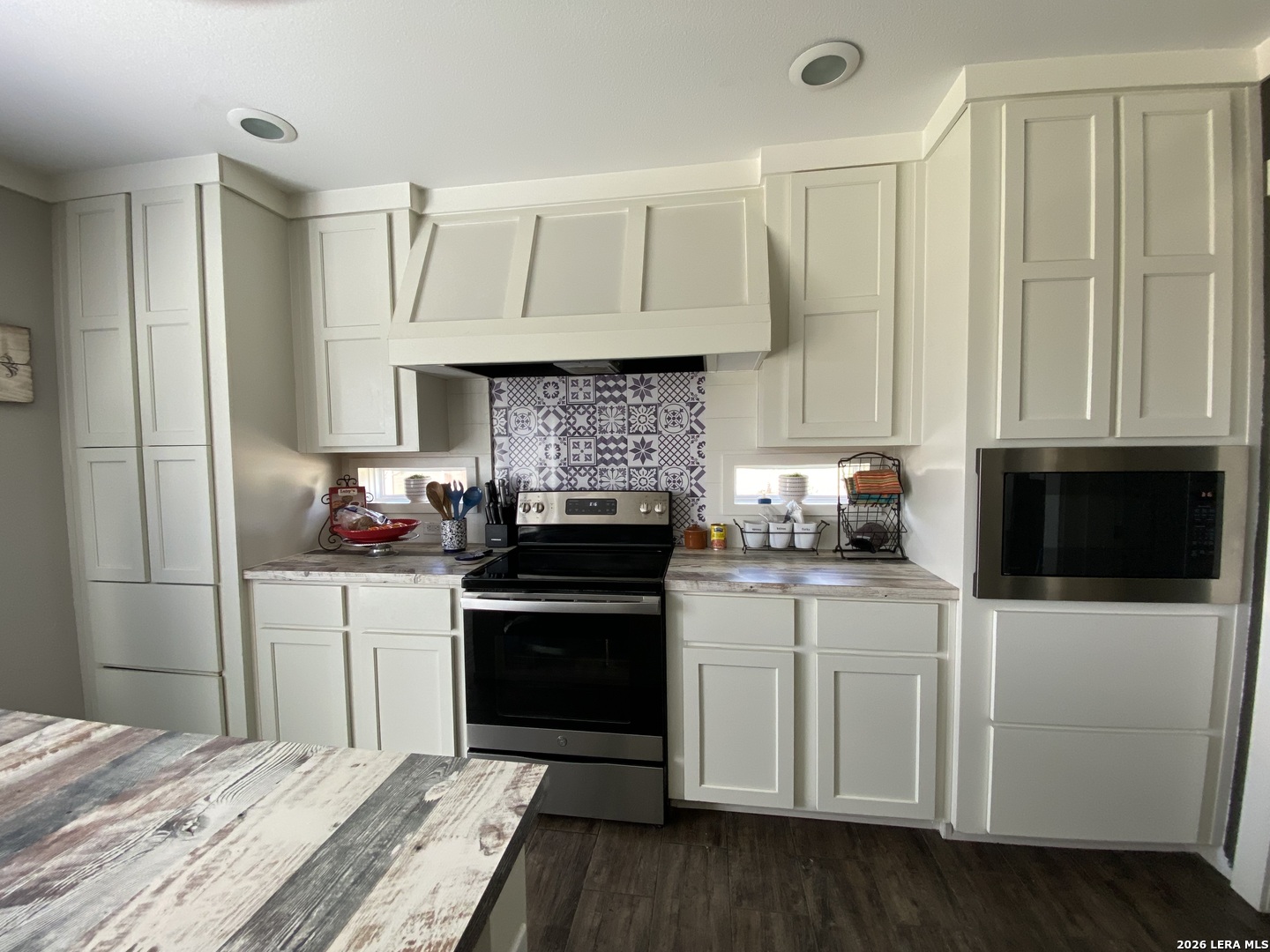 316 County Road 775 Devine, TX 78016 - Photo 8 of 10 a kitchen with a sink and cabinets