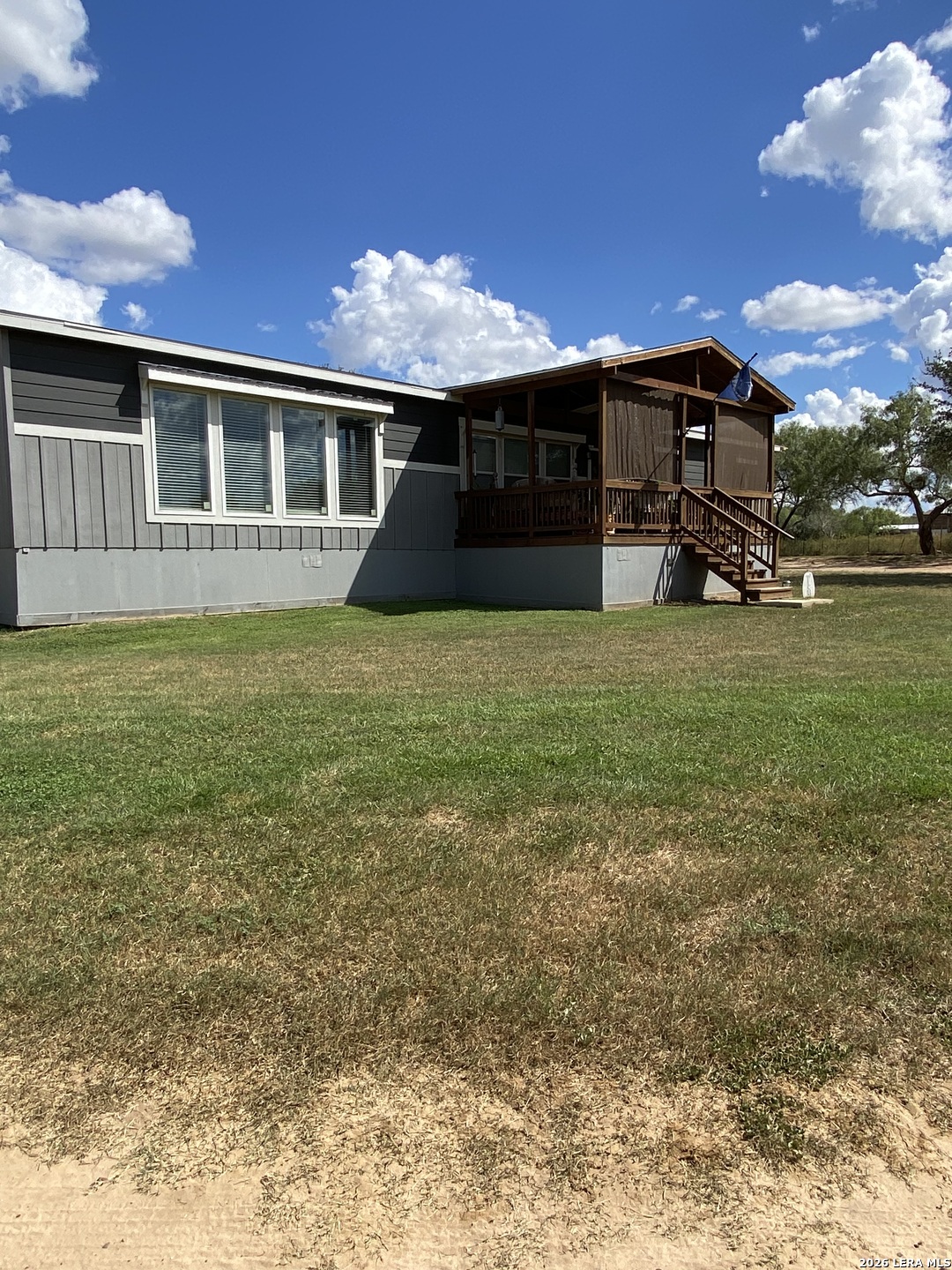316 County Road 775 Devine, TX 78016 - Photo 10 of 10 a front view of a house with a garden