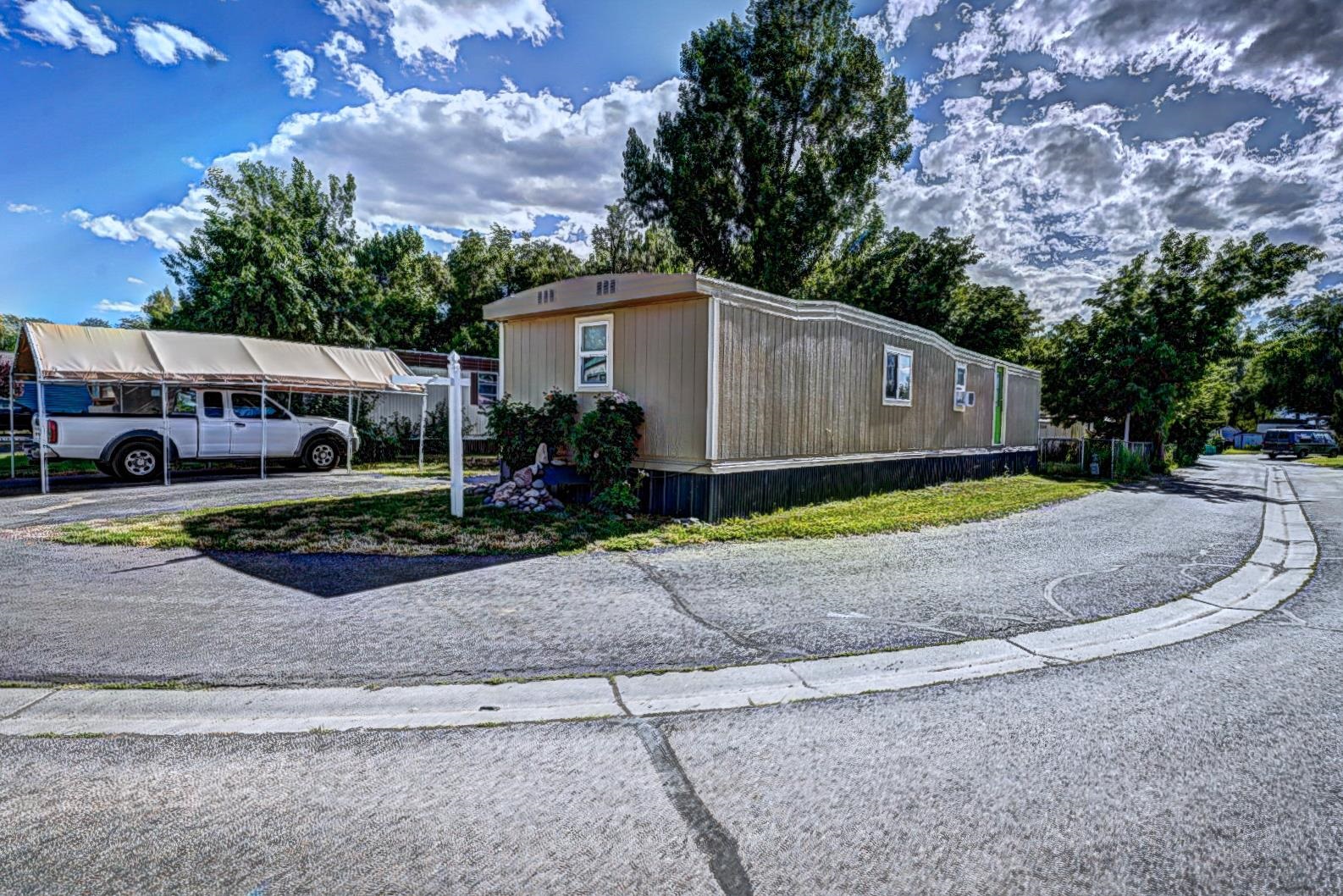 585-25 25 1/2 Road, Unit 72 Grand Junction, CO 81505 - Photo 1 of 21 a backyard of a house with lots of green space