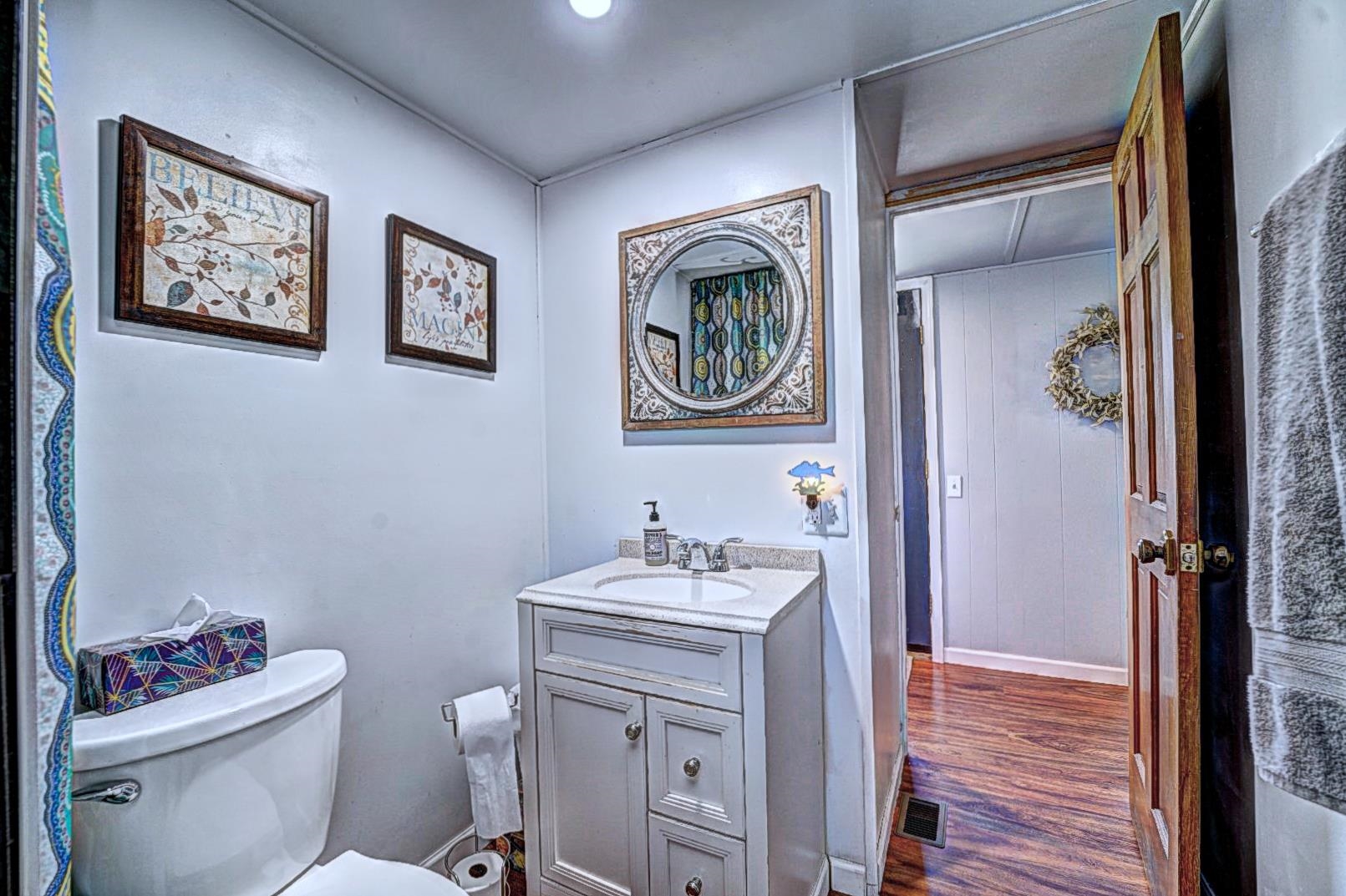 585-25 25 1/2 Road, Unit 72 Grand Junction, CO 81505 - Photo 12 of 21 a bathroom with a sink mirror vanity and toilet