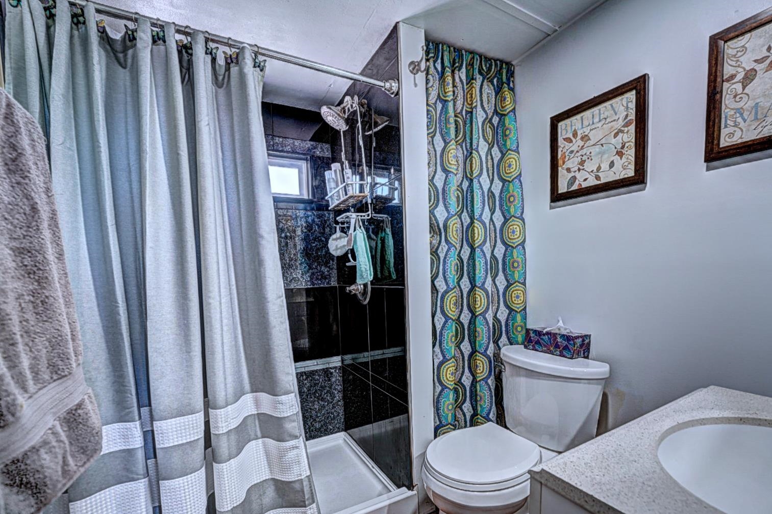 585-25 25 1/2 Road, Unit 72 Grand Junction, CO 81505 - Photo 13 of 21 a bathroom with a toilet and a shower