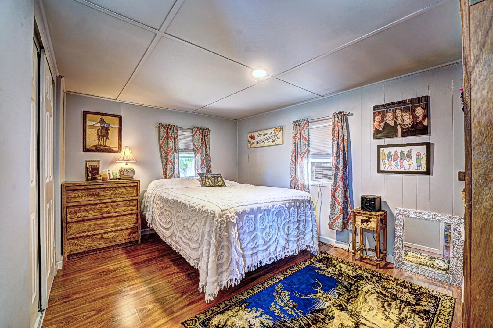 585-25 25 1/2 Road, Unit 72 Grand Junction, CO 81505 - Photo 14 of 21 a bedroom with a bed and a view of bathroom