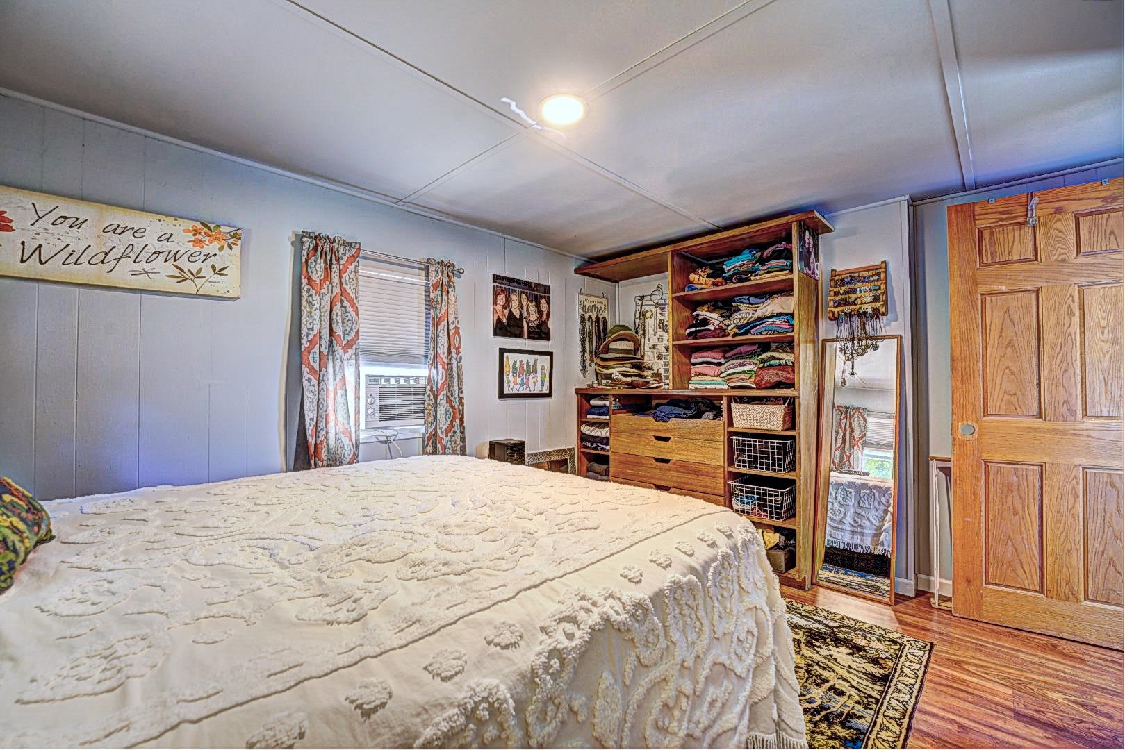 585-25 25 1/2 Road, Unit 72 Grand Junction, CO 81505 - Photo 15 of 21 a bedroom with a bed cabinets and a closet