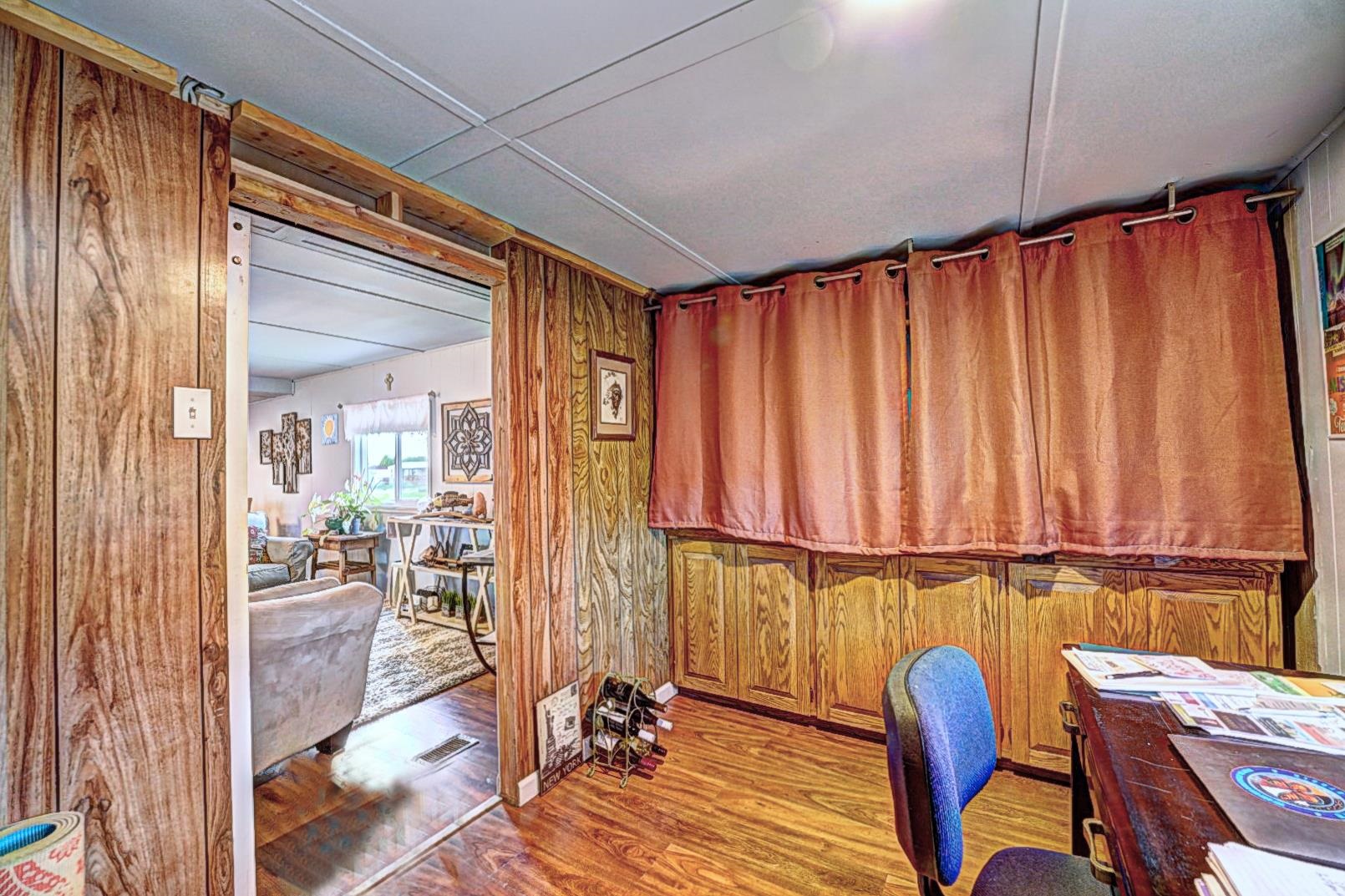 585-25 25 1/2 Road, Unit 72 Grand Junction, CO 81505 - Photo 8 of 21 a view of a room with furniture and wooden floor