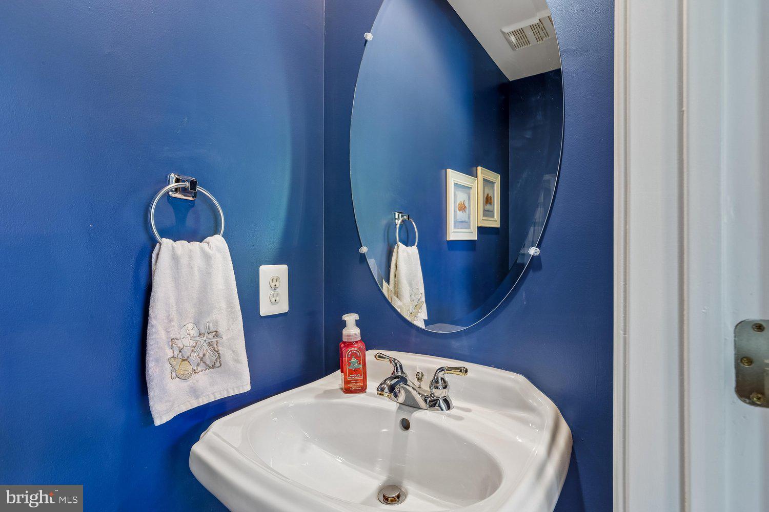 2396 Jostaberry Way Odenton, MD 21113 - Photo 11 of 55 a bathroom with a toilet sink and mirror