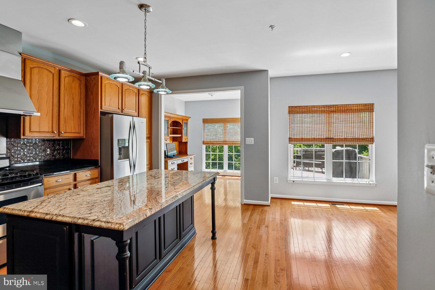 2396 Jostaberry Way Odenton, MD 21113 - Photo 12 of 55 a kitchen with stainless steel appliances granite countertop a stove and refrigerator