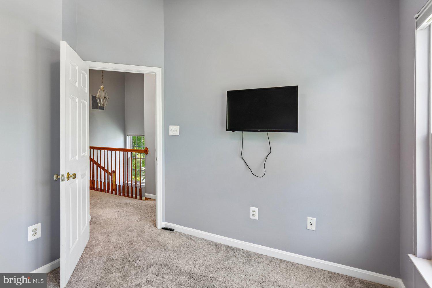 2396 Jostaberry Way Odenton, MD 21113 - Photo 34 of 55 a view of a living room with a flat screen tv