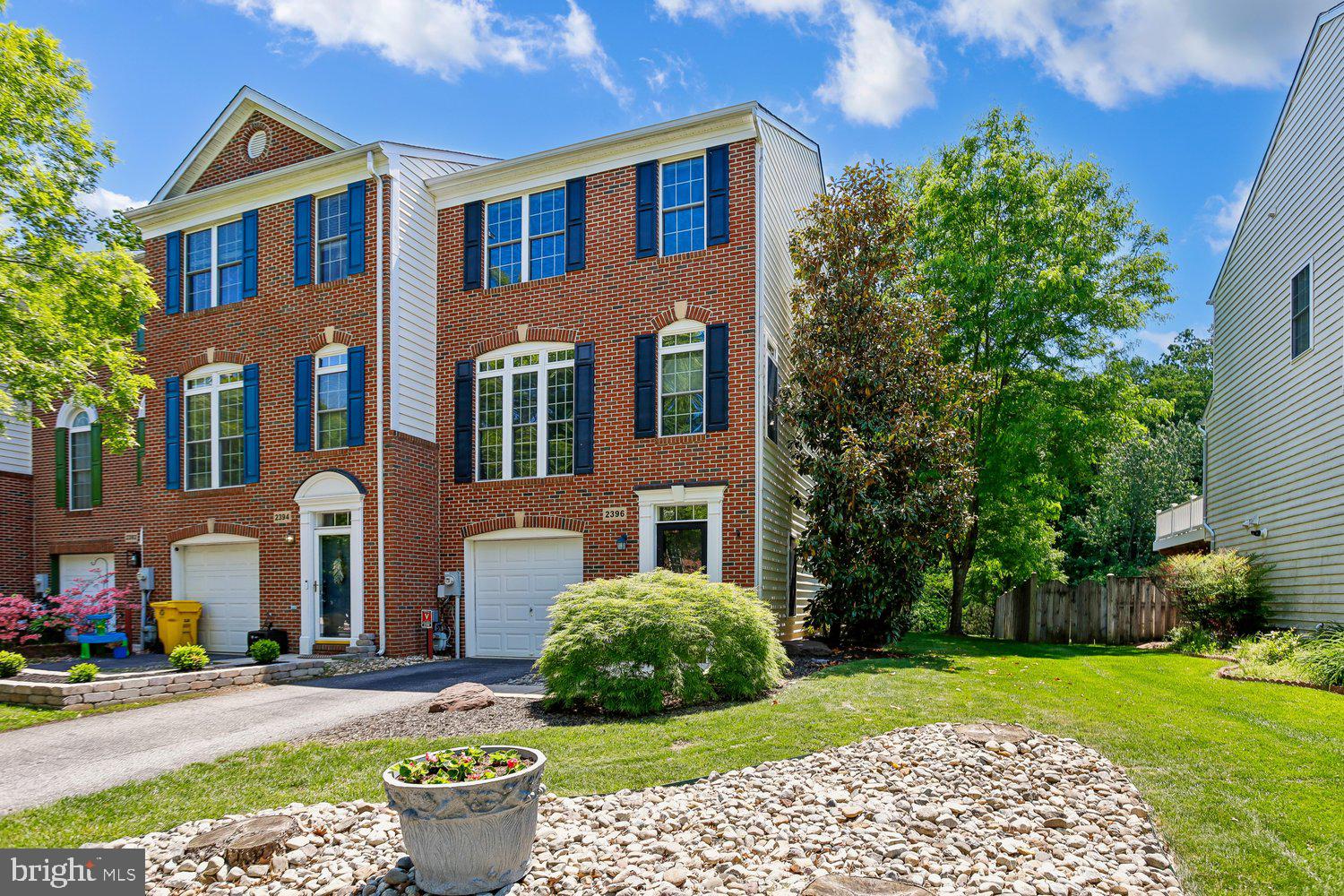 2396 Jostaberry Way Odenton, MD 21113 - Photo 4 of 55 a front view of a house with garden
