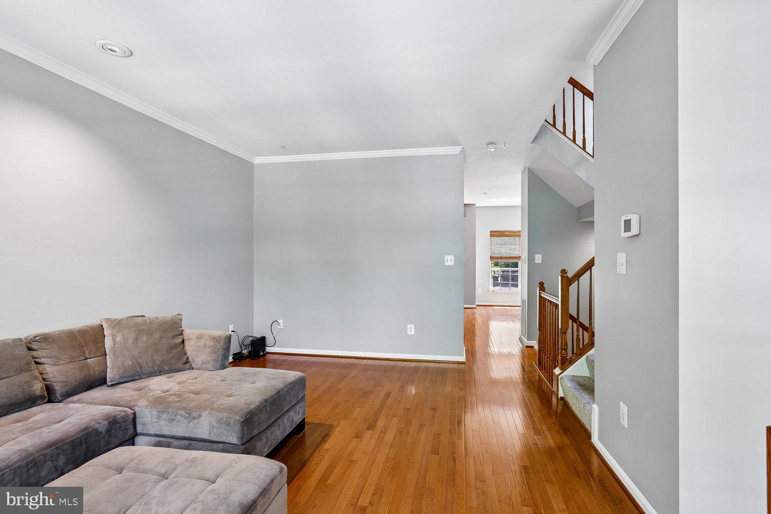 2396 Jostaberry Way Odenton, MD 21113 - Photo 9 of 55 a living room with furniture and a wooden floor