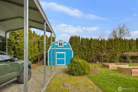 a view of a garden with an outdoor seating