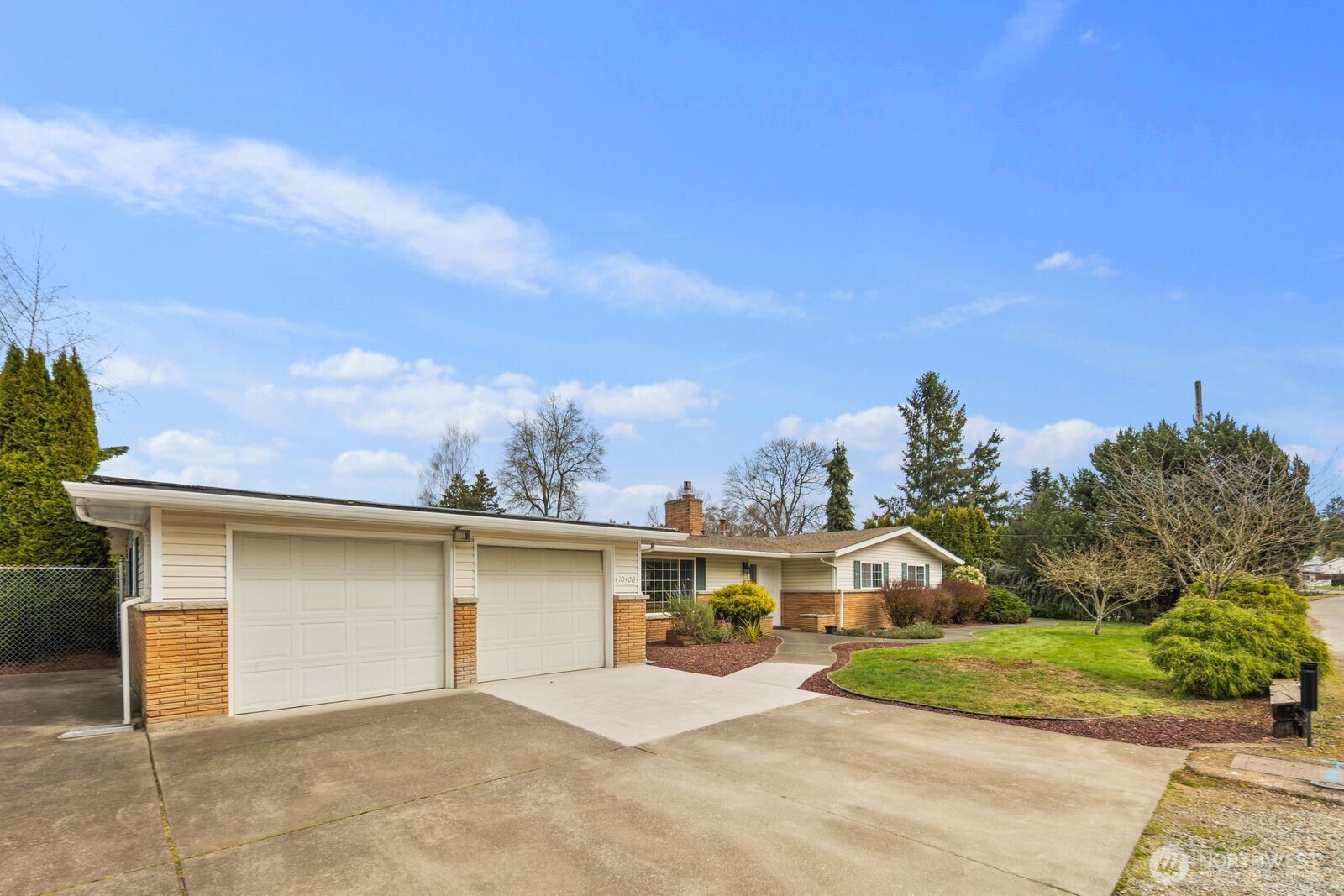 10400 Southeast 194th Place Renton, WA 98055 - Photo 22 of 25 a front view of a house with a yard and garage