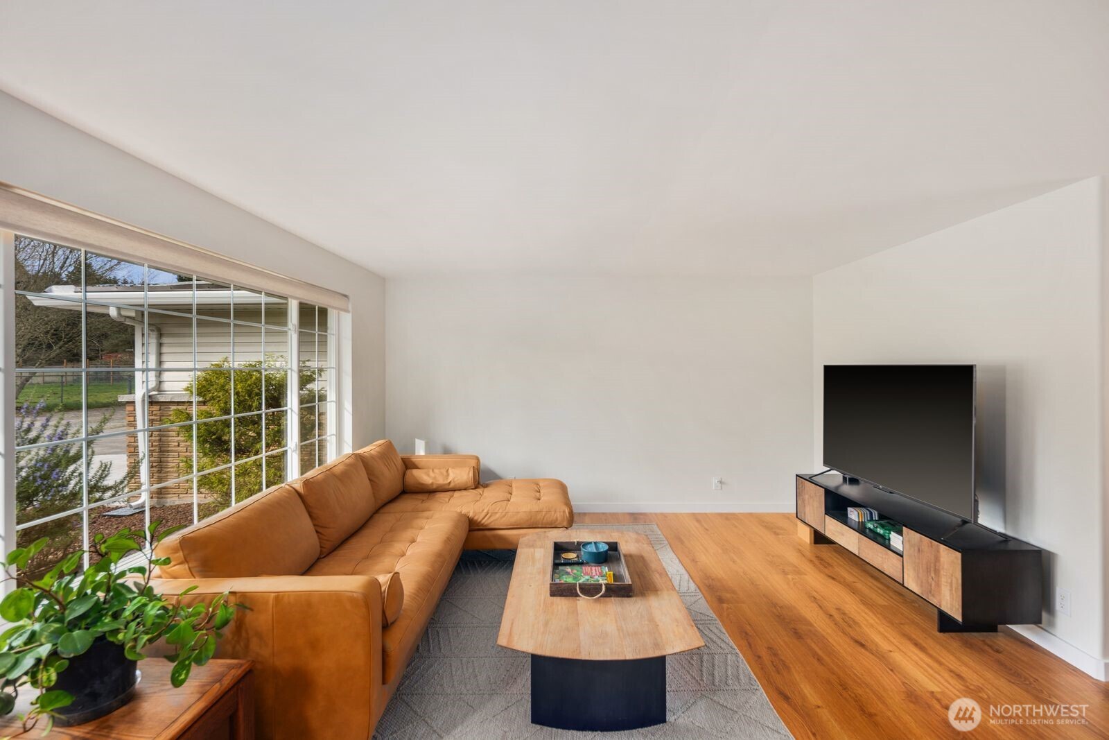 10400 Southeast 194th Place Renton, WA 98055 - Photo 5 of 25 a living room with furniture and a flat screen tv