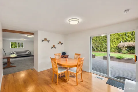 a view of a dining room with furniture window and outside view